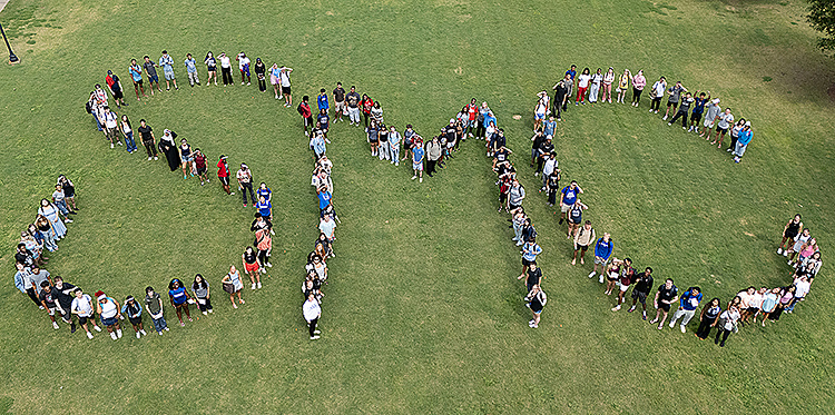 Group of students spelling out SMC shot from drone.