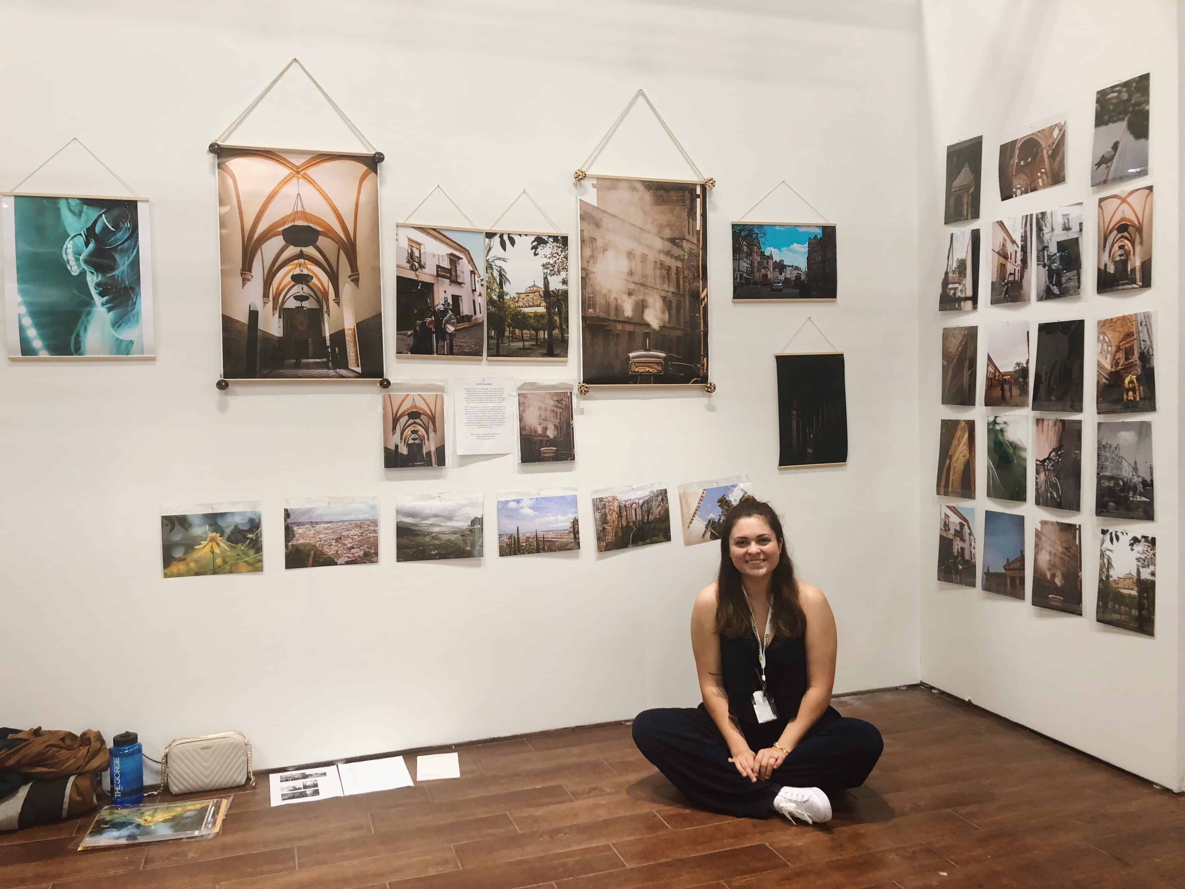 Amanda Cannon sitting in her art booth