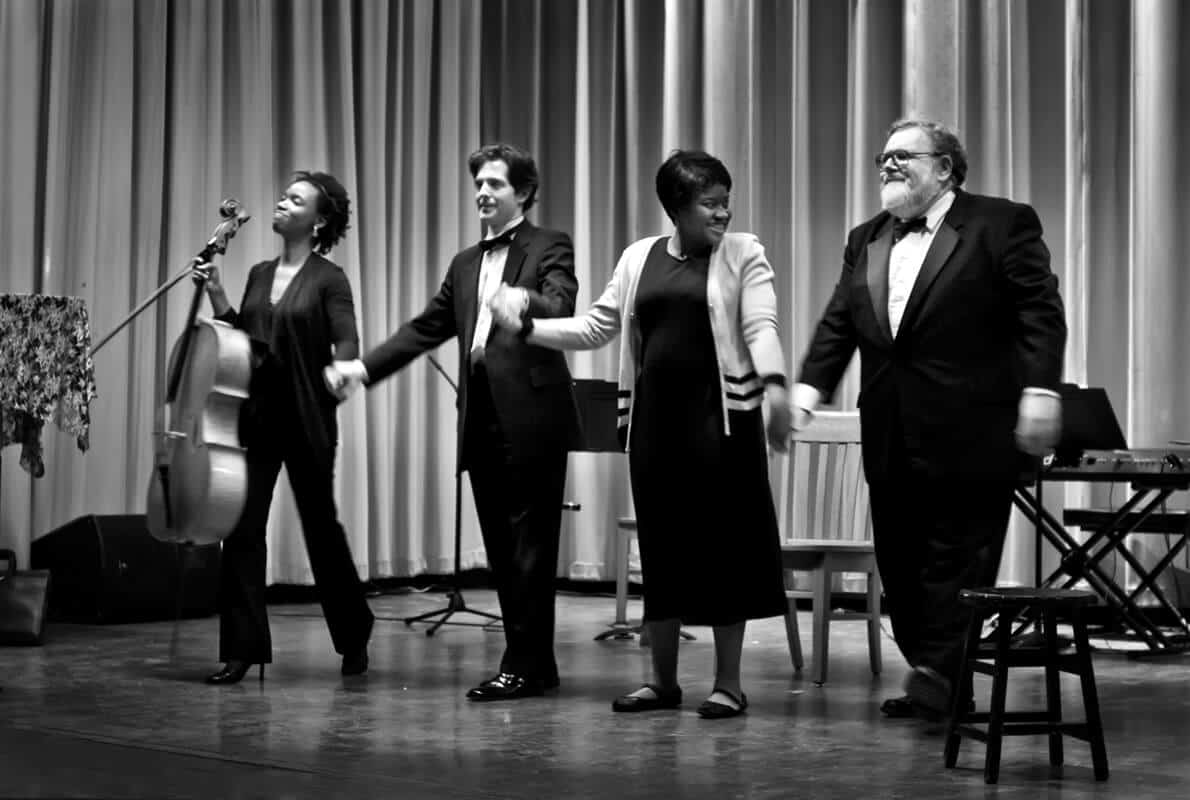 Musicians standing up to bow
