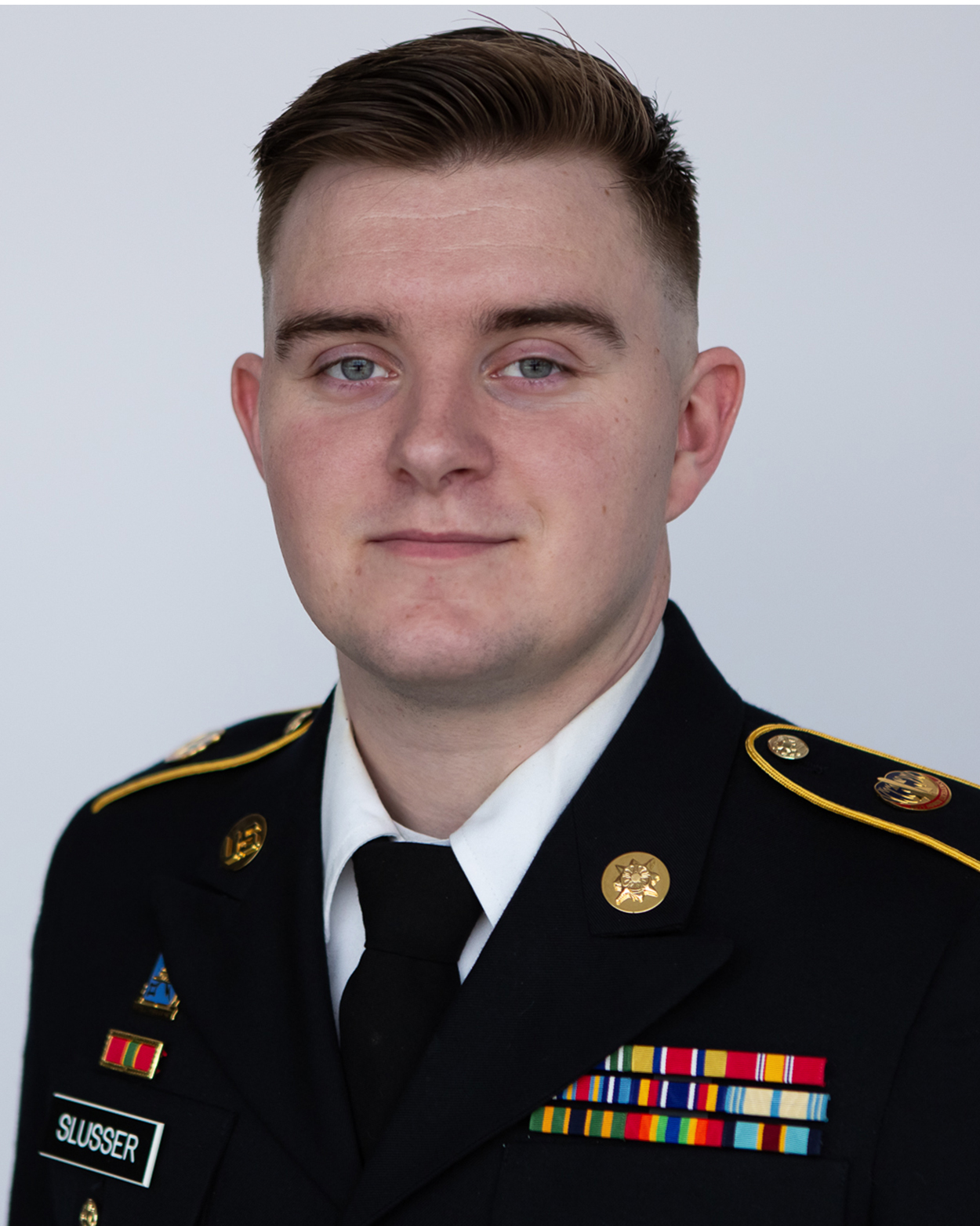 Denny Slusser headshot in Army uniform