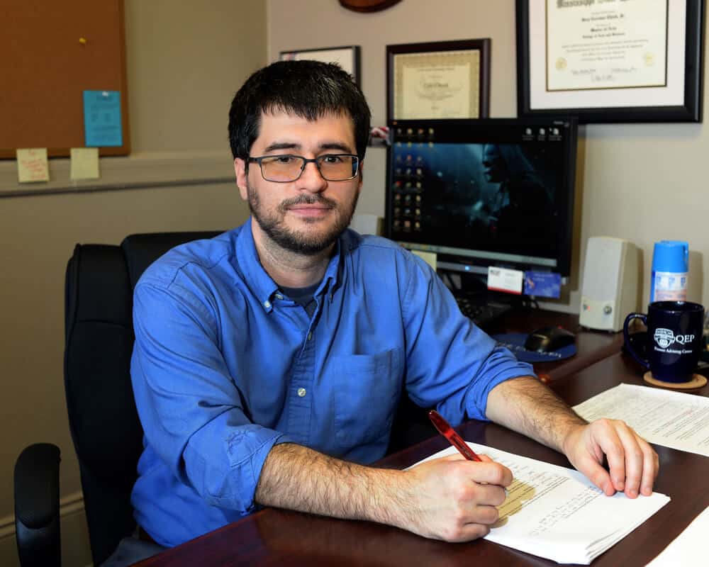 Cole Cheek at his desk