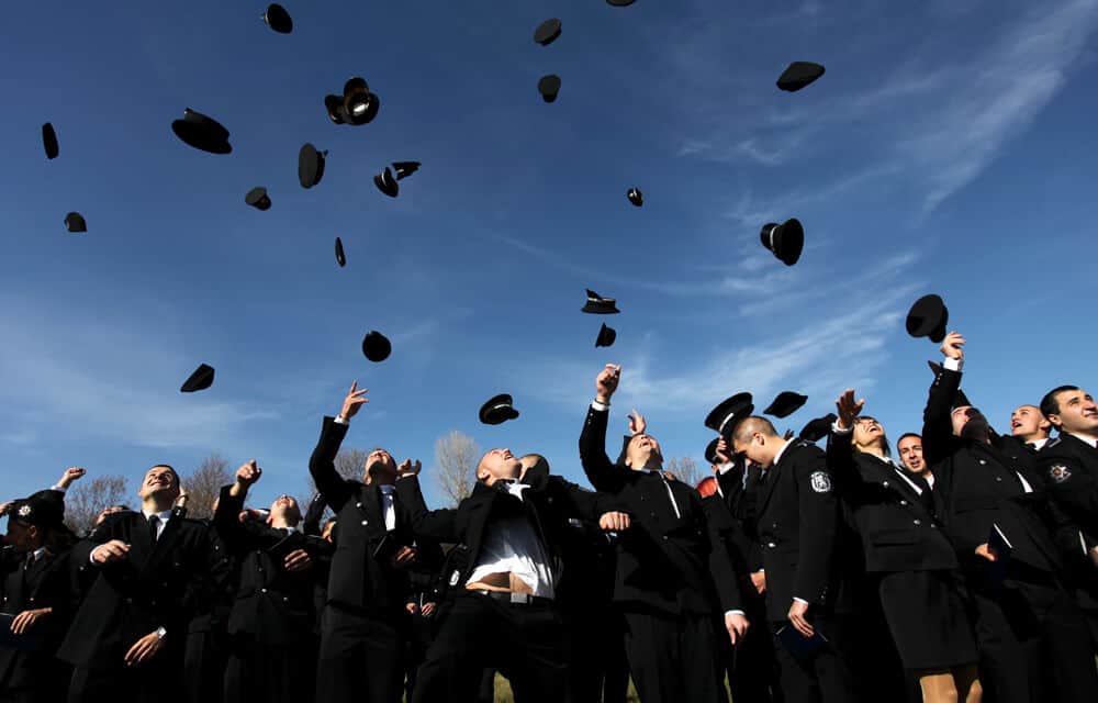 Military students throwing their hats in the air