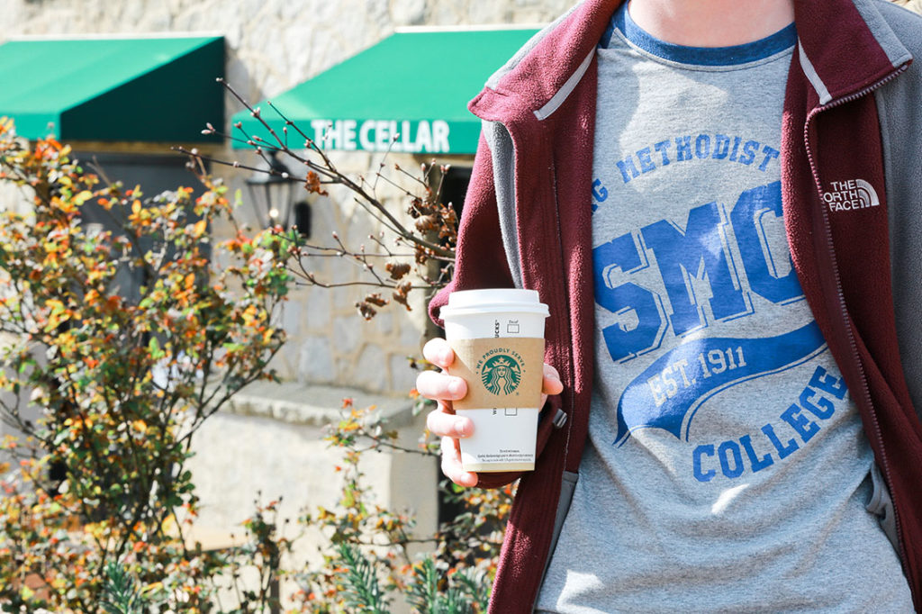 Student holding Starbucks cup