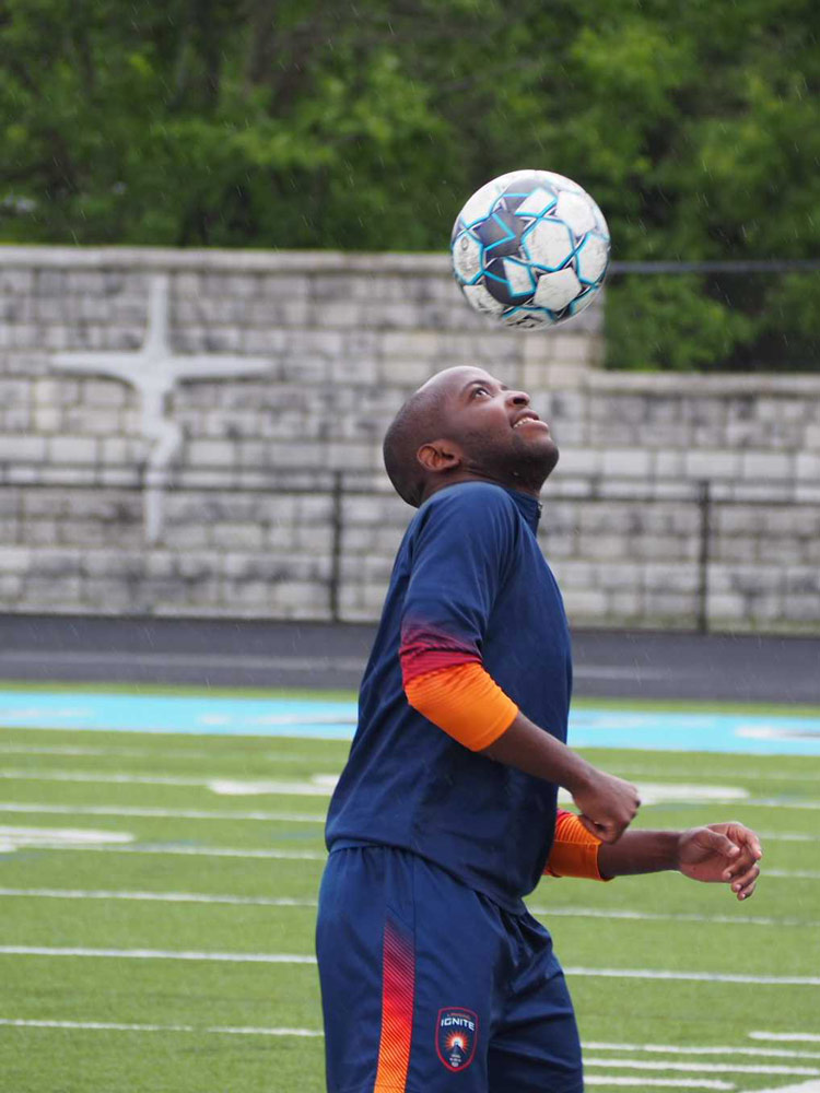 Elma Nfor heads soccer ball