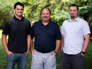 L to R: Andrew Hall, '12, Terry Hall '79, Christopher Hall '08