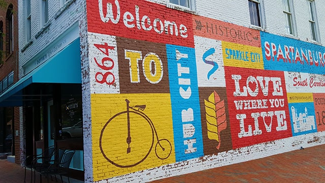 Mural in downtown Spartanburg that says love were you live
