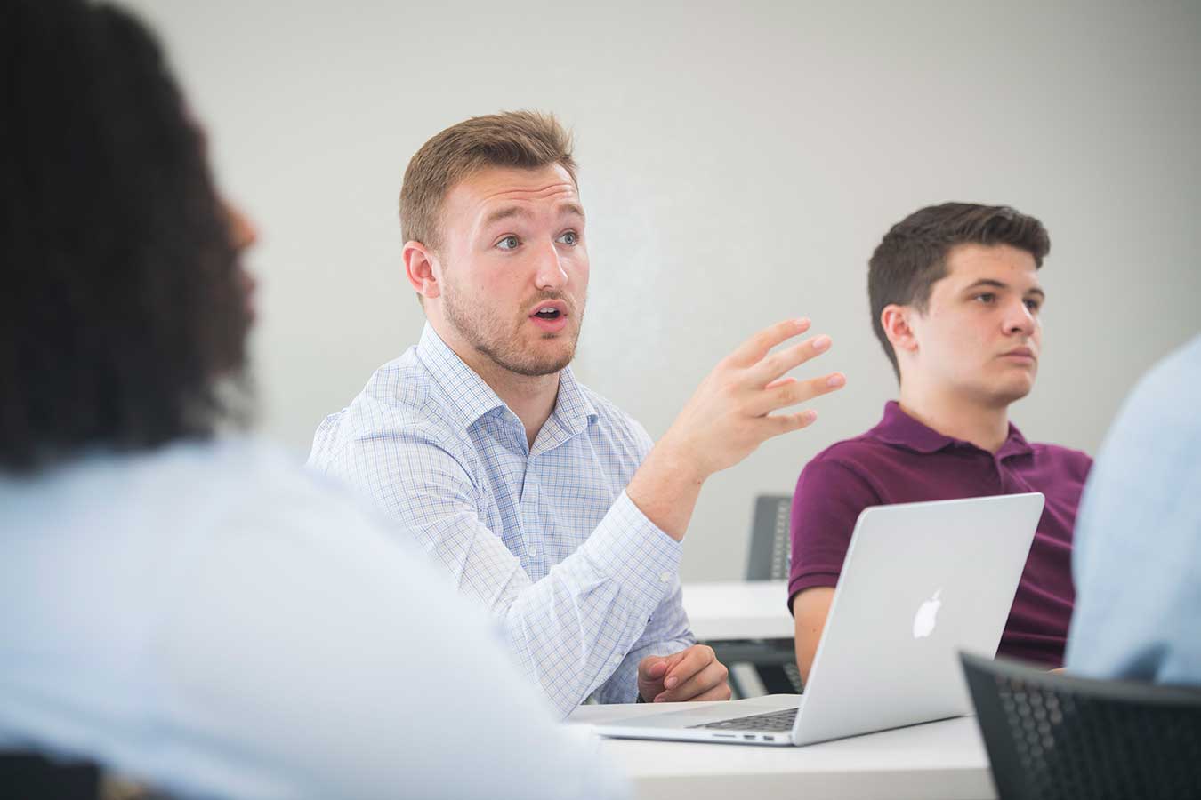 Man participating in class discussion