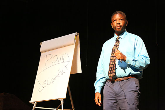 Issac Bailey standing on stage