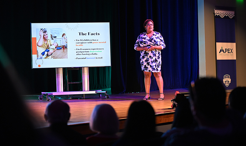 Photo of Olivia Jackson-Shaw presenting on stage