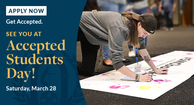 two female students at the dining hall smiling
