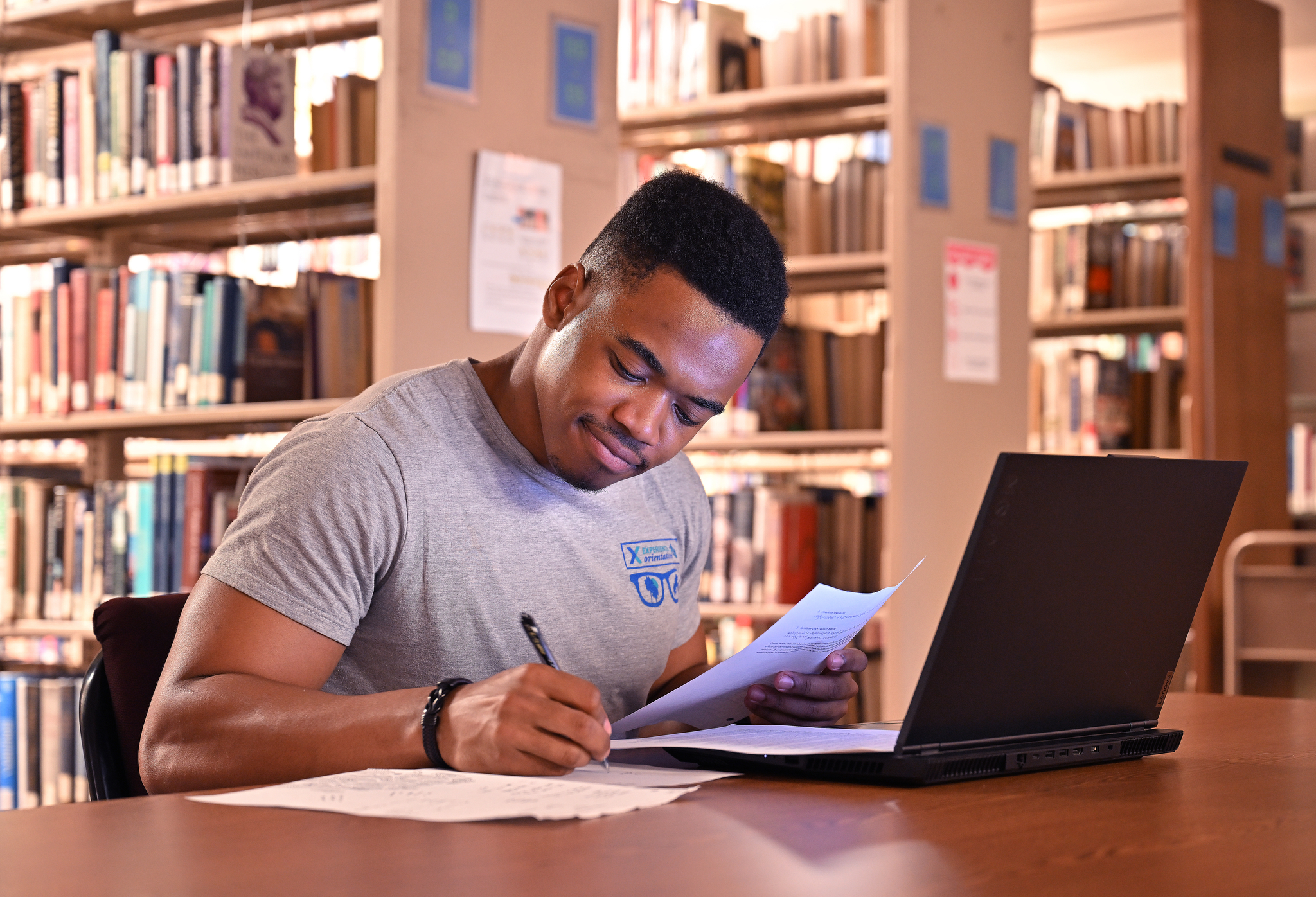 Student signing a document