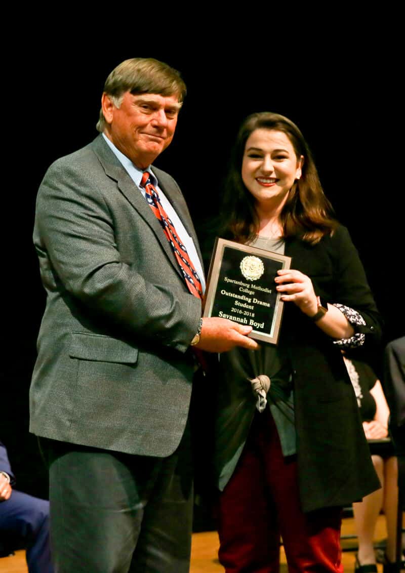 Student receiving award