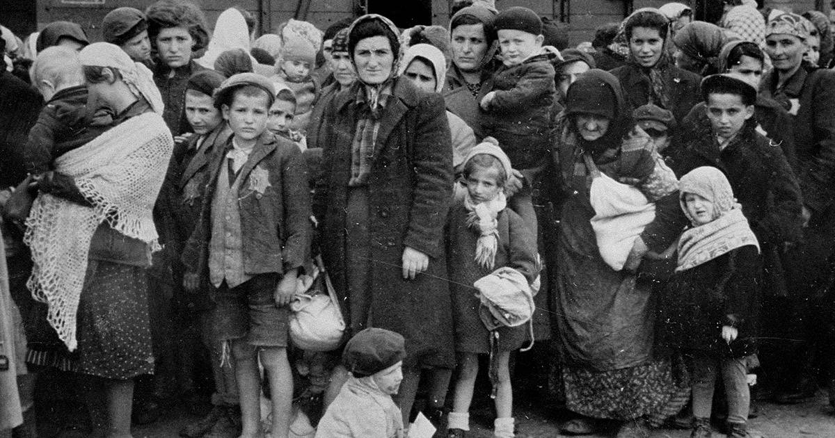 Old photograph of Jewish families in long lines